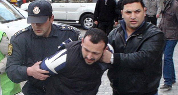 Policemen detaining a protester at the oppositional rally in Baku, April 17, 2011. Courtesy by the "Turan" Information Agency