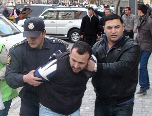 Policemen detaining a protester at the oppositional rally in Baku, April 17, 2011. Courtesy by the "Turan" Information Agency