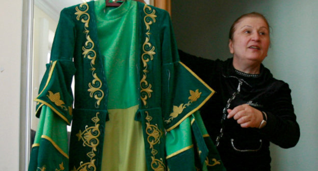 Isolda Gogichaeva, head of a Vladikavkaz sewing enterprise with a female dress. North Ossetia, Vladikavkaz, April 18, 2011. Photo by Kazbek Basaev for the "Caucasian Knot"