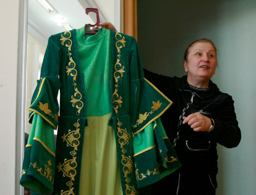 Isolda Gogichaeva, head of a Vladikavkaz sewing enterprise with a female dress. North Ossetia, Vladikavkaz, April 18, 2011. Photo by Kazbek Basaev for the "Caucasian Knot"