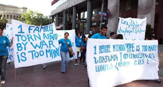 Armenian refugees from Azerbaijan march along streets with posters. Yerevan, June 20, 2011. Photo: Photolure