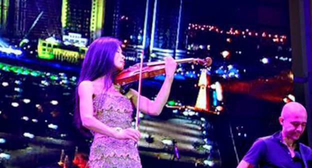Vanessa Mae performing at celebrations of the Day of Grozny, October 5, 2011. Photo by Albert Tokaev