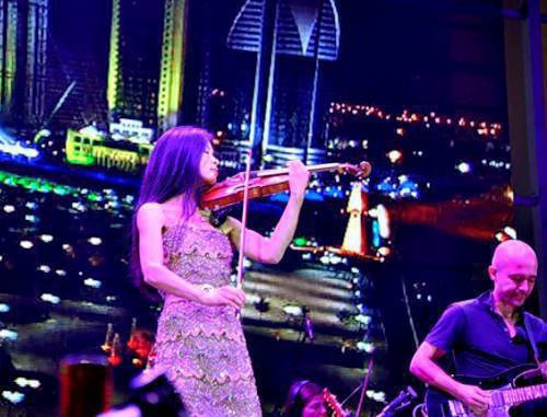 Vanessa Mae performing at celebrations of the Day of Grozny, October 5, 2011. Photo by Albert Tokaev