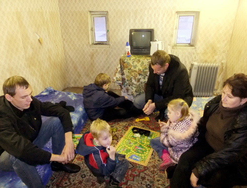 Revenko family in their garage adapted for living, Sochi, December 24, 2011. Photo by Svetlana Kravchenko for the "Caucasian Knot"