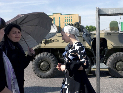 Project "Grozny: Nine Cities". Women at a metal detector for screening spectators of the Victory Day Parade, May 9, 2010. Photo by Olga Kravets, borrowed from the page of the project http://strana.lenta.ru/russia/grozny.htm