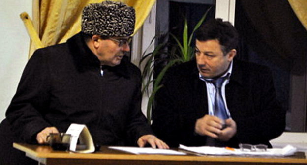 Magomed Idrisov (on the right), Chairman of the Precinct Election Commission (PEC) No. 1147, with some unidentified person, who accused observers from the "Novaya Gazeta" of illegal agitation, Dagestan, Makhachkala, March 4, 2012. Photo by Gurizada Kamalova, http://gurizada.livejournal.com/