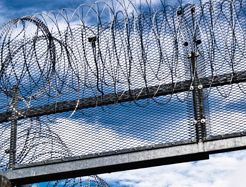 Prison fence. Courtesy of http://www.flickr.com/photos/x1klima/7637108374