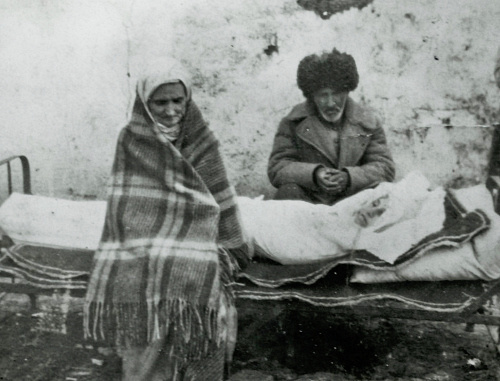 Forced migrants Avdarkhan Cazdiev and his wife Luli Gazdieva (Esieva) with their dead daughter Madina, Kazakhstan, 1946. Photo from http://old.ingushetiyaru.org