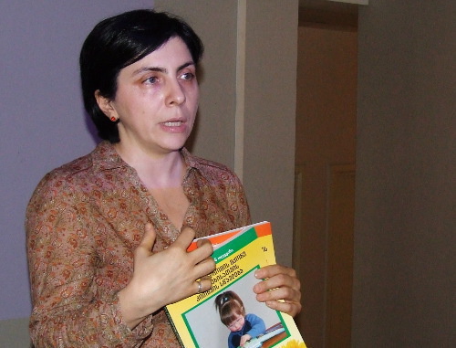 Nino Tsintsadze, Head of the NGO "Our Children", presenting a manual for development of children with Down syndrome; Tbilisi, March 21, 2013. Photo by Edita Badasyan for the "Caucasian Knot"