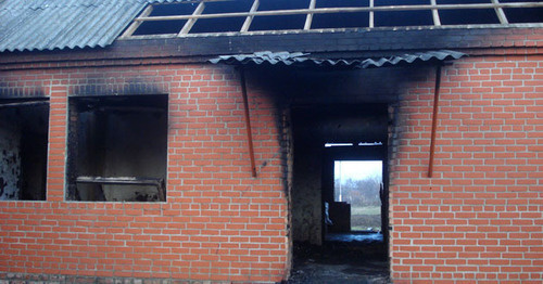 House burned down by law enforcers in the village of Yandi, Achkhoi-Martan District, December 7 2014. Photo provided by the HRC "Memorial" press-service.