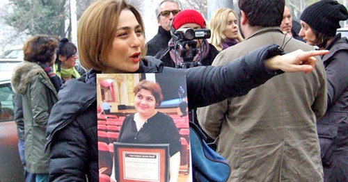 Nino Daneliya, a participant of the action, holds a poster with the photo of the journalist Khadija Ismayilova. Tbilisi, December 10, 2014. Photo by Edita Badasyan for the "Caucasian Knot