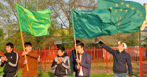 Young people holding flags of flag of Karachay–Cherkessia. April 25, 2014. Photo by Asya Kapaeva for the "Caucasian Knot"