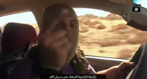 Screenshot of the video calling for jihad against Russia that was posted by "Islamic State" (IS), banned in Russia by the court and recognized as a terrorist organization, st.com/Middle-East/ISIS-Threat/ISIS-Listen-Putin-we-will-come-to-Russia-and-kill-you-at-your-homes-462919