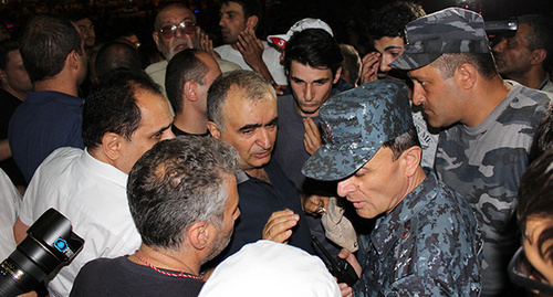 Participants of protest actions in Yerevan and police officer. Photo by Tigran Petrosyan for the ‘Caucasian Knot’. 