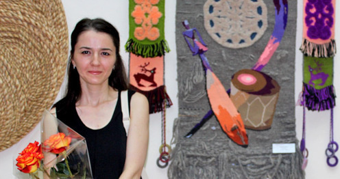 Artist Marian Ismail and her artwork 'Music at midnight', tapestry. Exhibition "Autumn-2016", Nalchik, August 31, 2016. Photo by Lyudmila Maratova for the 'Caucasian Knot'. 