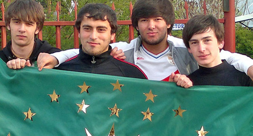 Young people holding a Circassian flag. Photo by the "Caucasian Knot" correspondent Asya Kapaeva