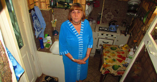 Nadezhda Shakhmardanova says that starting from July, floor in her municipal apartment in Chekhov Street began to go down, while the apartment is permanently flooded by groundwater, Astrakhan, September 2016. Photo by Vyacheslav Yaschenko for the 'Caucasian Knot'. 