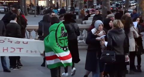 Chechen emigrants at the memorial action held in the center of Paris, France. Photo: screenshot of the video by "Krym. Realii", https://ru.krymr.com/a/28328651.html