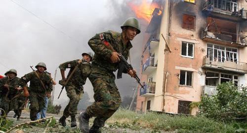 Georgian soldiers in Gori after Russia's bombing of a residential block. August 9, 2008. Photo: REUTERS/Gleb Garanich 