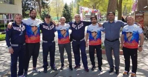 Members of the Georgian national freestyle wrestling team wearing Russian Tri-color T-shirts. Photo: RFE/RL