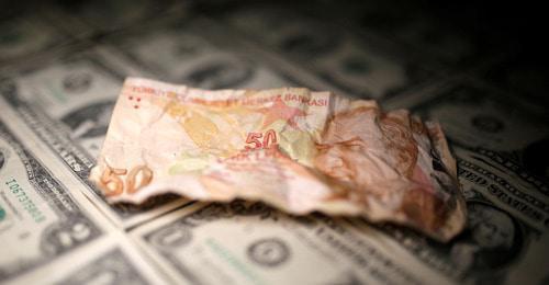 The Turkish lira and the dollars. Photo: REUTERS/Dado Ruvic/Illustration
