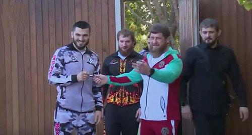Arthur Beterbiev (from the left) and Ramzan Kadyrov (second from the right). Screenshot of the video by the user Grozny TV Channel https://www.youtube.com/watch?v=guzPGYKihYc