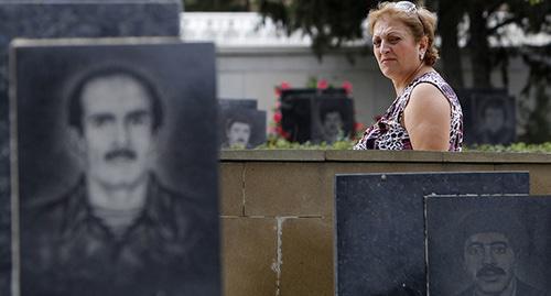 Woman at the cemetery of those perished in the Karabakh conflict, Baku. Photo: REUTERS/David Mdzinarishvili