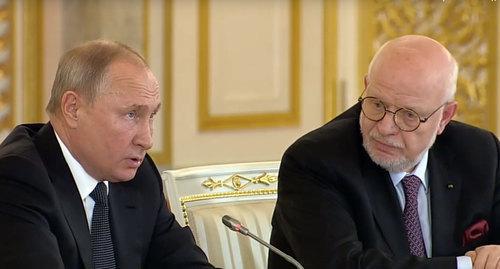 Vladimir Putin (on the left) and Mikhail Fedotov at the session of the Human Rights Council http://president-sovet.ru/presscenter/news/read/5119/