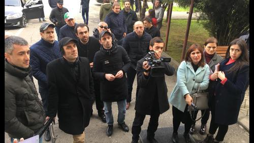 Protesters and journalists near the buiding of the Parliament of Abkhazia on February 2, 2019. Photo by Dmitry Stateynov for the "Caucasian Knot"