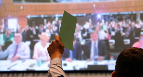 Voting during the session of the Parliamentary Assembly (PA) of the OSCE (Organisation for Security and Cooperation in Europe). Photo by the press service of the PA OSCE https://www.flickr.com/photos/oscepa/albums/72157709462707676