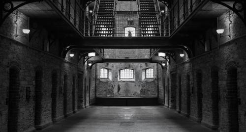 A prison. Photo Tracy Lundgren from Pixabay, https://pixabay.com/photos/prison-jail-dark-creepy-lockup-1331203/