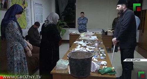 A woman is accused of witchcraft at the meeting with Adam Elzhurkaev, chief physician of the Islamic Medicine Centre in Grozny. Screenshot from video posted by 'Grozny' TV Channel: https://www.youtube.com/watch?v=pWIsYVfKLmY