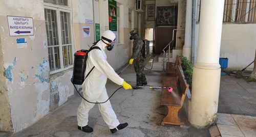 Worker in a protective suit is conducting disinfection, Abkhazia. Photo: press service of the Ministry for Emergencies of Abkhazia