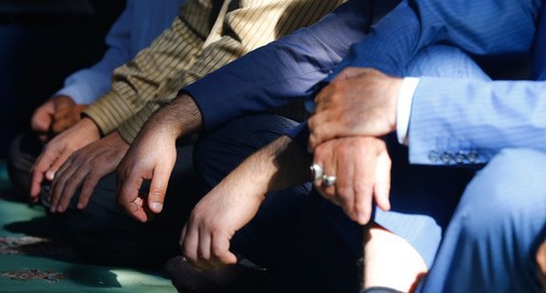 Hand of people praying. Photo by Aziz Karimov for the Caucasian Knot