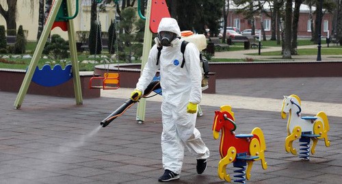 Disinfection of children's playground. Photo: REUTERS/Eduard Korniyenko