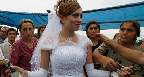 A wedding in the Caucasus. Photo: Reuters /Thomas Peter (RUSSIA)