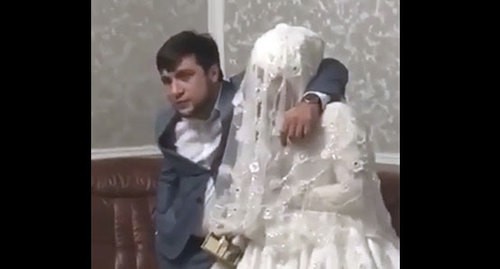 Resident of Dagestan and his bride. Screenshot: https://vk.com/golos_dagestan?w=wall-74219800_766567