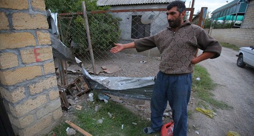 Resident of Azerbaijani village shows traces of shelling attacks. Photo by Aziz Karimov for the Caucasian Knot