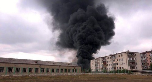 A smoke cloud rising above the building in Stepanakert, October 4, 2020. A screen capture from the video by the "Bars" documentary film studio