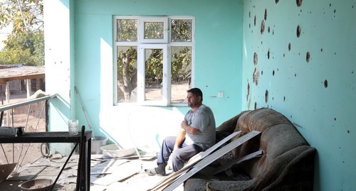 A local resident sitting in a house damaged by shelling. October 20, 2020. Photo by Aziz Karimov for the "Caucasian Knot"