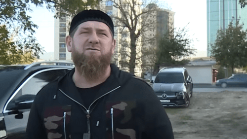 Ramzan Kadyrov standing in front of a car with tinted windows. Photo: https://youtu.be/alYmCZ8QxMk