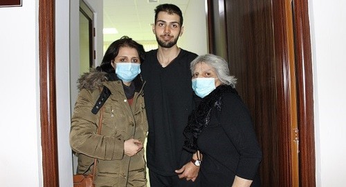 Ruslan Tumanyan with his mother and grandmother. Medical centre in Stepanakert, December 23, 2020. Photo by Alvard Grigoryan for the Caucasian Knot