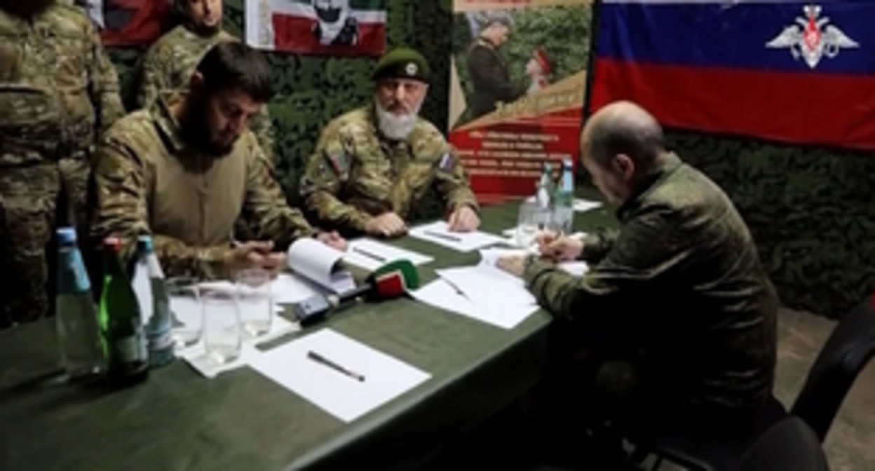Signing the contract of the  Russian Ministry of Defence with the "Akhmat" volunteer units. Adam Delimkhanov is in the centre. June 12, 2023. Photo by the press service of the Russian Ministry of Defence