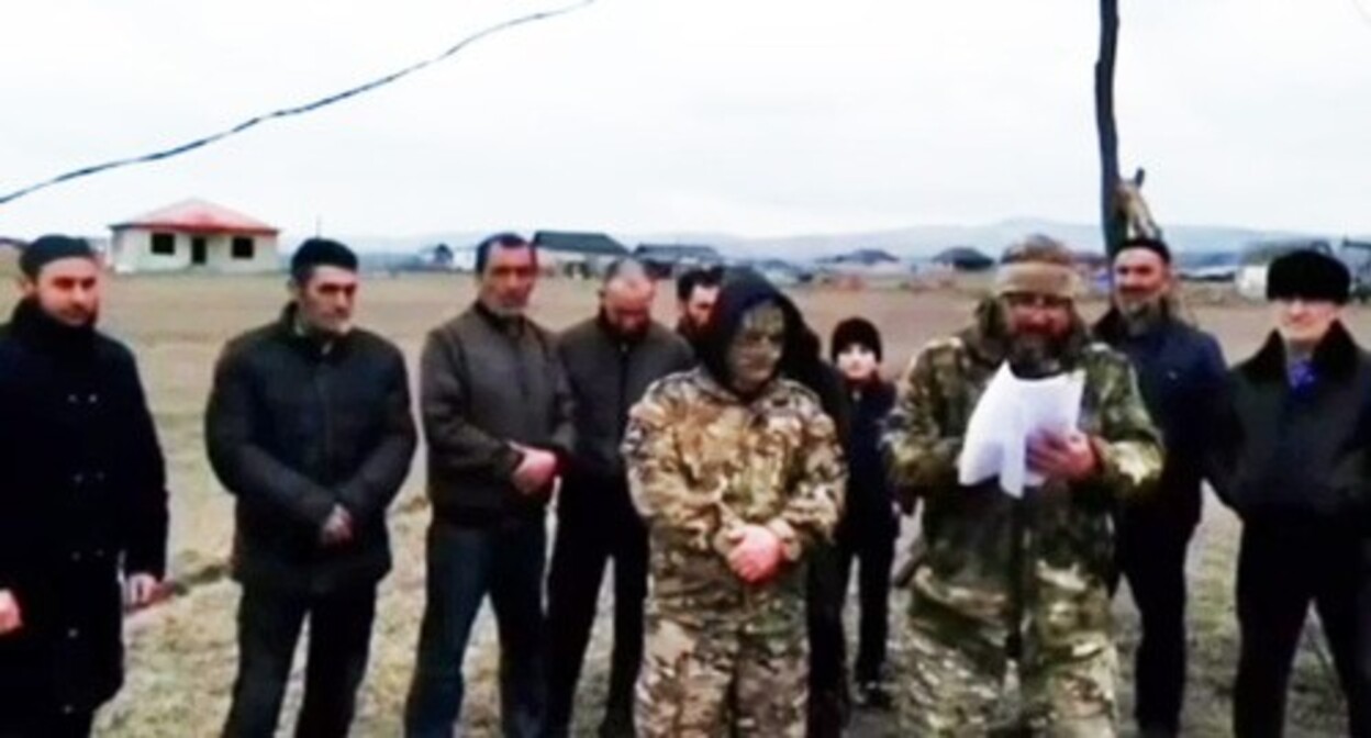 Murat Esmurziev (in the center)  records a video appeal to Putin. Screenshot of a video published by the "Fortanga" https://t.me/fortangaorg/17448