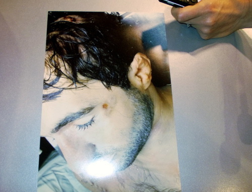 One of the photos of dead Ibragim Todashev, showed at the press conference at RIA-Novosti. Moscow. May 29, 2013. Photo by Karina Gadzhieva for the “Caucasian Knot”.