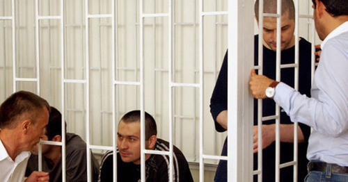 The defendants in the case of the terror act, which killed Sheikh Said Afandi al-Chirkawi and their advocates at the court session. Makhachkala, July 30, 2014. Photo by Aida Magomedova for the "Caucasian Knot"