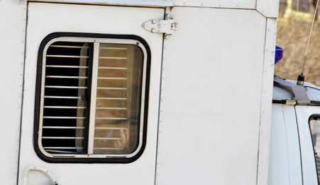 The defendants in the case against the BORN in the prisoner transport vehicle. Moscow, March 18, 2015. Photo by Magomed Tuaev for the "Caucasian Knot"