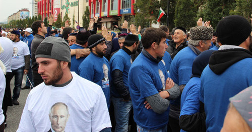 Young men at the rally on Putin's birthday in Grozny. Photo by Magomed Magomedov for the "Caucasian Knot"