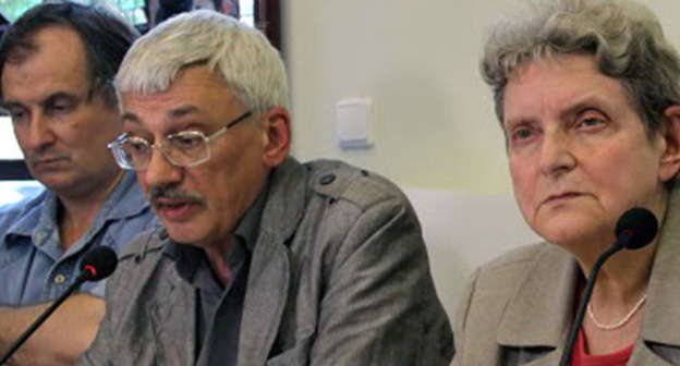 Alexander Cherkasov, Oleg Orlov, Svetlana Gannushkina (from left to the right) at the opening of  the exhibition "The Never-Ending Story: Violence and Impunity in Northern Caucasus". Moscow, July 15, 2015. Photo by Karina Gadzhieva for the "Caucasian Knot"