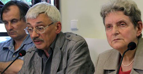 Alexander Cherkasov, Oleg Orlov, Svetlana Gannushkina (from left to the right) at the opening of  the exhibition "The Never-Ending Story: Violence and Impunity in Northern Caucasus". Moscow, July 15, 2015. Photo by Karina Gadzhieva for the "Caucasian Knot"